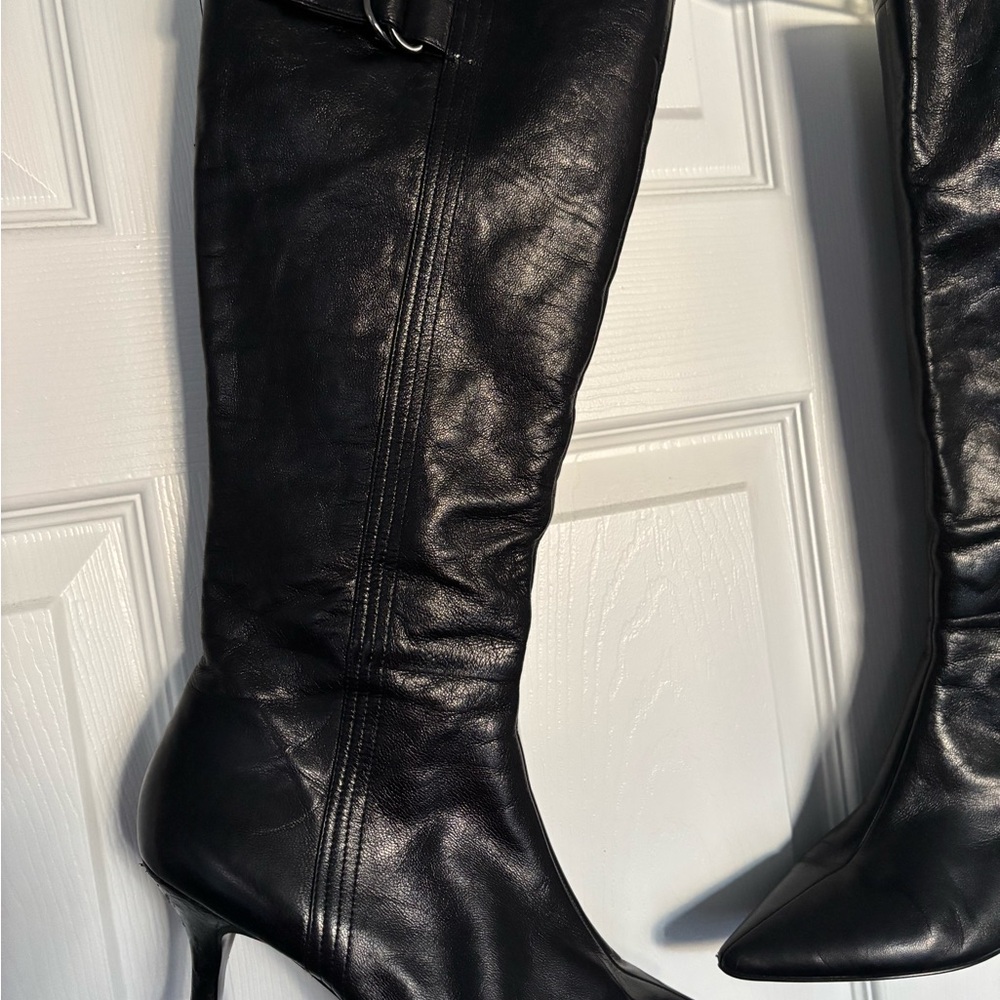 Black Heeled Boots. Leather beginning to peel on inside band. Scuff on heel